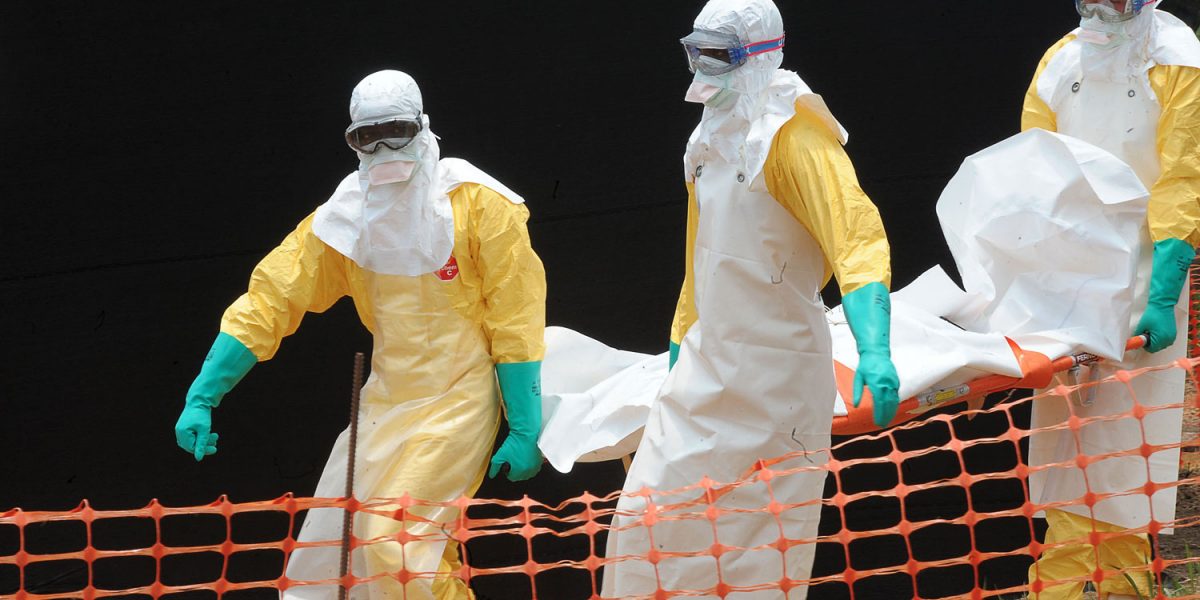 (FILES) -- A file photo taken on April 1, 2014 shows staff of the "Doctors without Borders" ('Medecin sans frontieres) medical aid organisation carrying the body of a person killed by viral haemorrhagic fever, at a center for victims of the Ebola virus in Guekedou. More than 200 people have died from the highly contagious Ebola virus in Guinea, making it one of the worst ever outbreaks of the deadly haemorrhagic fever, the World Health Organization said on June 4, 2014. The UN's health agency said it so far had registered 328 confirmed or suspected cases of Ebola in Guinea, including 208 deaths, with 21 deaths registered between May 29 and June 1 alone.   AFP PHOTO / SEYLLOUSEYLLOU/AFP/Getty Images